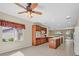 Open kitchen with island and view to living room at 2250 Bensley St, Henderson, NV 89044