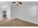 Well-lit bedroom featuring carpet floors and a ceiling fan at 2470 Lothian St, Henderson, NV 89044