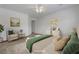 Bright and airy main bedroom featuring a comfortable seating area at 2470 Lothian St, Henderson, NV 89044