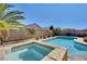 Relaxing spa adjacent to refreshing pool in sunny backyard at 2470 Lothian St, Henderson, NV 89044