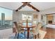 Bright dining room with hardwood floors, a round table, and beautiful sunset views at 2777 Paradise Rd # 2001, Las Vegas, NV 89109