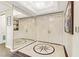 Elegant entryway with a large mirror, double doors, and compass-design tile floor at 2777 Paradise Rd # 2001, Las Vegas, NV 89109