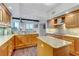 Modern kitchen with granite countertops, wood cabinetry, and stainless steel appliances at 2777 Paradise Rd # 2001, Las Vegas, NV 89109