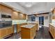 Gourmet kitchen with granite counters, wood cabinets, and stainless steel appliances at 2777 Paradise Rd # 2001, Las Vegas, NV 89109