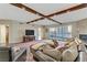 Spacious living room with hardwood floors, exposed beams, and city views at 2777 Paradise Rd # 2001, Las Vegas, NV 89109