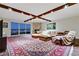 Living room with hardwood floors, a large rug, and exposed wood beams at 2777 Paradise Rd # 2001, Las Vegas, NV 89109