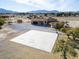 Aerial showing home, court, and desert landscape at 3281 Mark Rd, Pahrump, NV 89060