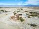 Aerial view of single story home with solar panels and mountain views at 3281 Mark Rd, Pahrump, NV 89060