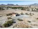 Aerial view of house with solar panels and spacious lot in desert setting at 3281 Mark Rd, Pahrump, NV 89060