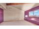 Large bedroom with window, AC unit, and wood trim at 3281 Mark Rd, Pahrump, NV 89060
