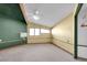 Spacious bedroom with wood beams, window, and ceiling fan at 3281 Mark Rd, Pahrump, NV 89060