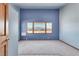 Bedroom with triple windows and mountain views at 3281 Mark Rd, Pahrump, NV 89060