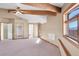 Large bedroom with carpet, window seat, and access to bathroom at 3281 Mark Rd, Pahrump, NV 89060