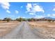 Gravel driveway leading to ranch house at 3281 Mark Rd, Pahrump, NV 89060