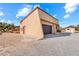 Home's exterior boasts a large garage and detached shed at 3281 Mark Rd, Pahrump, NV 89060