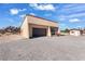 Attached garage with additional shed in background at 3281 Mark Rd, Pahrump, NV 89060