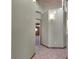 Light and bright hallway with tile flooring at 3281 Mark Rd, Pahrump, NV 89060
