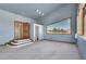 Living room with unique window and access to bathroom at 3281 Mark Rd, Pahrump, NV 89060