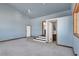 Living room with built in steps leading to bath at 3281 Mark Rd, Pahrump, NV 89060