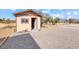 Tan storage shed with gravel driveway at 3281 Mark Rd, Pahrump, NV 89060