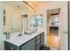 Modern bathroom with double vanities and views to an upper level at 394 Gatlinburg Ct, Henderson, NV 89012