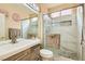 Updated bathroom with a walk-in shower, modern vanity, and elegant tile at 394 Gatlinburg Ct, Henderson, NV 89012