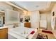Bathroom with a large soaking tub, double vanity, and separate shower at 394 Gatlinburg Ct, Henderson, NV 89012