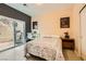 Comfortable bedroom with backyard access, and a desk workspace at 394 Gatlinburg Ct, Henderson, NV 89012