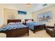 Bright bedroom featuring two twin beds and a relaxing atmosphere at 394 Gatlinburg Ct, Henderson, NV 89012