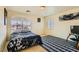 Comfortable bedroom with a queen bed and a striped rug at 394 Gatlinburg Ct, Henderson, NV 89012
