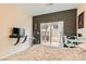 Bright bedroom features private backyard access and a workspace at 394 Gatlinburg Ct, Henderson, NV 89012