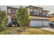 Two-story house with a two-car garage and landscaped front yard at 394 Gatlinburg Ct, Henderson, NV 89012