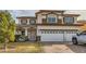 Two-story house with a two-car garage and landscaped front yard at 394 Gatlinburg Ct, Henderson, NV 89012