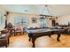 Game room features a pool table, wet bar, and seating area at 394 Gatlinburg Ct, Henderson, NV 89012
