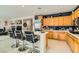 Bright kitchen features an island with seating, ample cabinetry, and stainless steel appliances at 394 Gatlinburg Ct, Henderson, NV 89012