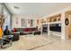 Spacious living area features a sectional sofa, fireplace, and built-in entertainment center at 394 Gatlinburg Ct, Henderson, NV 89012
