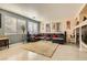 Relaxing living room with sectional sofa, large TV, and a cozy fireplace at 394 Gatlinburg Ct, Henderson, NV 89012