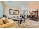 Spacious living room with beige couch and large rug at 394 Gatlinburg Ct, Henderson, NV 89012