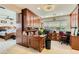 Home office with built-in cabinetry, desk, and adjacent bedroom access at 394 Gatlinburg Ct, Henderson, NV 89012