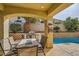 Patio with seating, built-in BBQ, and pool access at 394 Gatlinburg Ct, Henderson, NV 89012