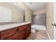 Clean bathroom, granite countertop vanity, and shower/tub combo at 5098 River Glen Dr # 220, Las Vegas, NV 89103