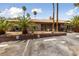 Building exterior, parking lot, and landscaping at 5098 River Glen Dr # 220, Las Vegas, NV 89103