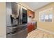Stainless steel refrigerator in galley kitchen at 5098 River Glen Dr # 220, Las Vegas, NV 89103