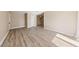 Living area with wood-look floors and neutral walls at 5098 River Glen Dr # 220, Las Vegas, NV 89103