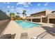 Refreshing community pool with lounge chairs at 5098 River Glen Dr # 220, Las Vegas, NV 89103