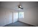 Bedroom with double door closet and ceiling fan at 545 Playa Linda Pl, Las Vegas, NV 89138