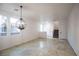 Bright dining room with tile floors and a modern chandelier at 545 Playa Linda Pl, Las Vegas, NV 89138