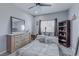 Cozy bedroom with dresser, bed, and bookcase at 5650 E Sahara Ave # 1012, Las Vegas, NV 89142