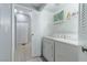 Laundry room with washer, dryer, and extra shelving at 5650 E Sahara Ave # 1012, Las Vegas, NV 89142