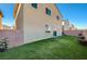 Private backyard with artificial turf and patio furniture at 5694 Colbert St, North Las Vegas, NV 89081